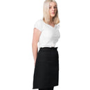 Woman wearing a white top and black apron skirt on a white background